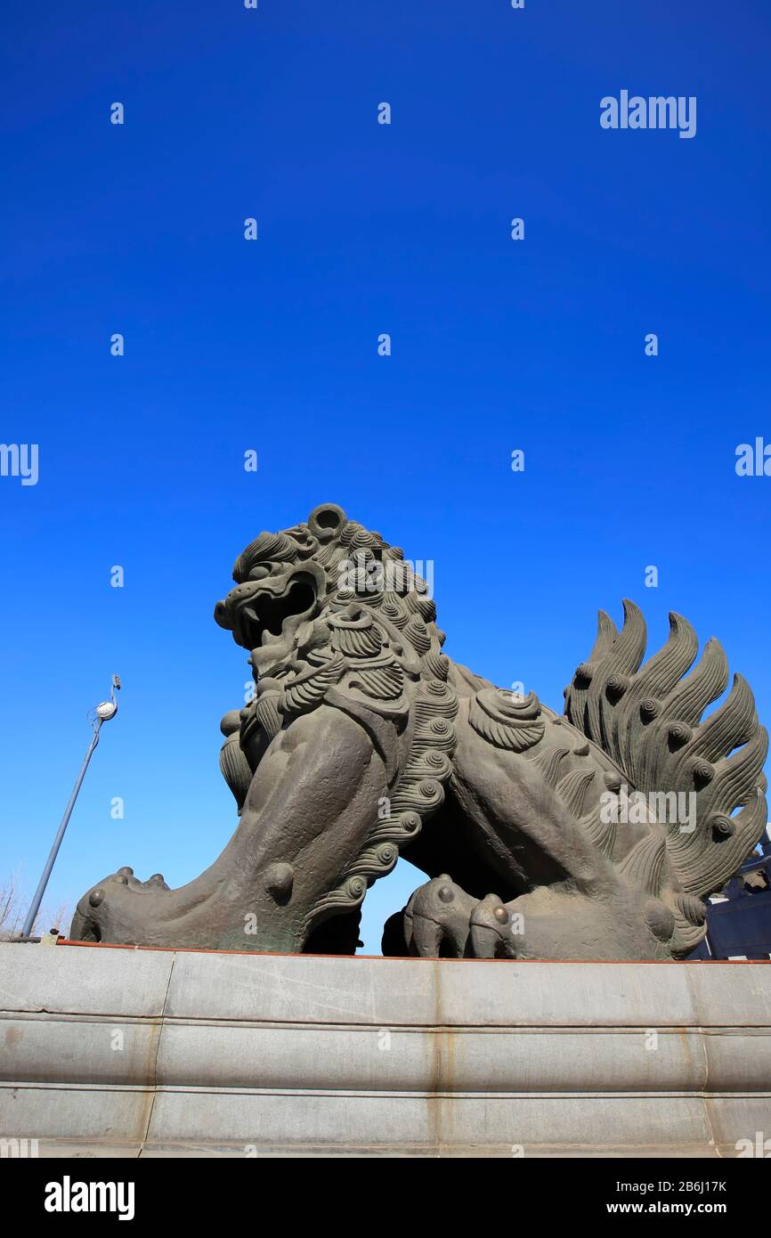 Bronze lion under the blue sky Stock Photo - Alamy