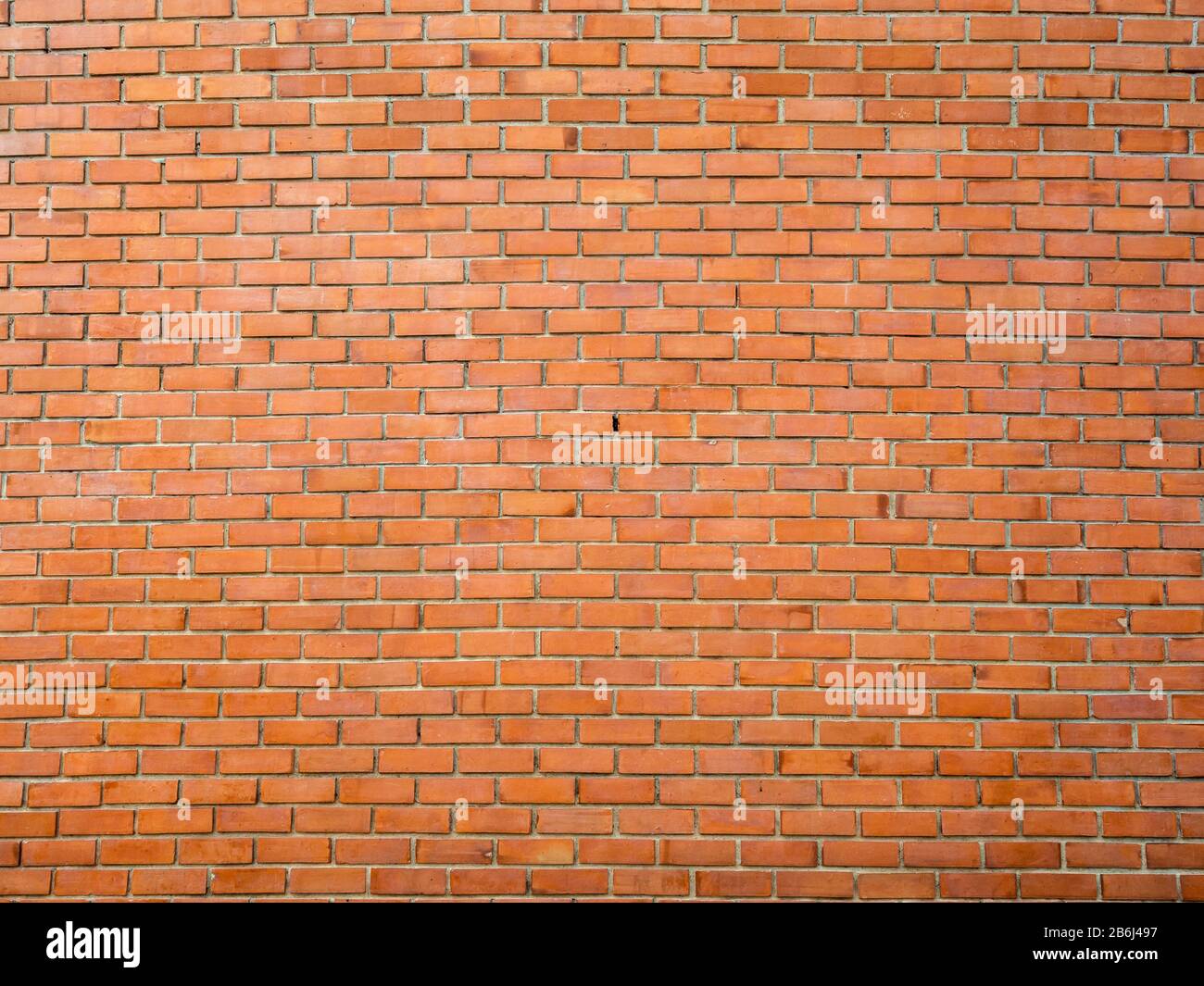 Red brick wall background. Seamless brick wall texture. Stock Photo