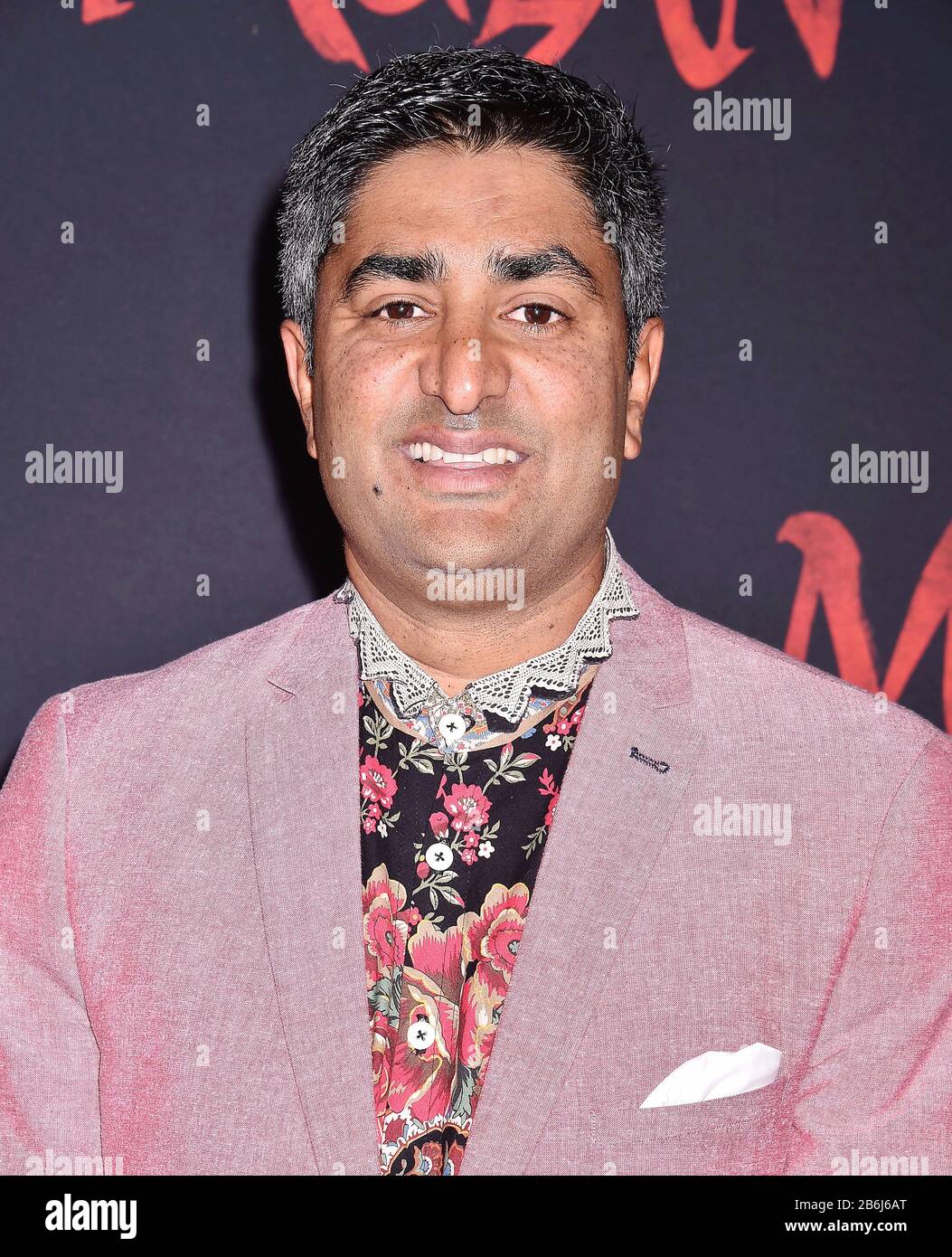 HOLLYWOOD, CA - MARCH 09: Chum Ehelepola attends the premiere of Disney's 'Mulan' at the El Capitan Theatre on March 09, 2020 in Hollywood, California. Stock Photo