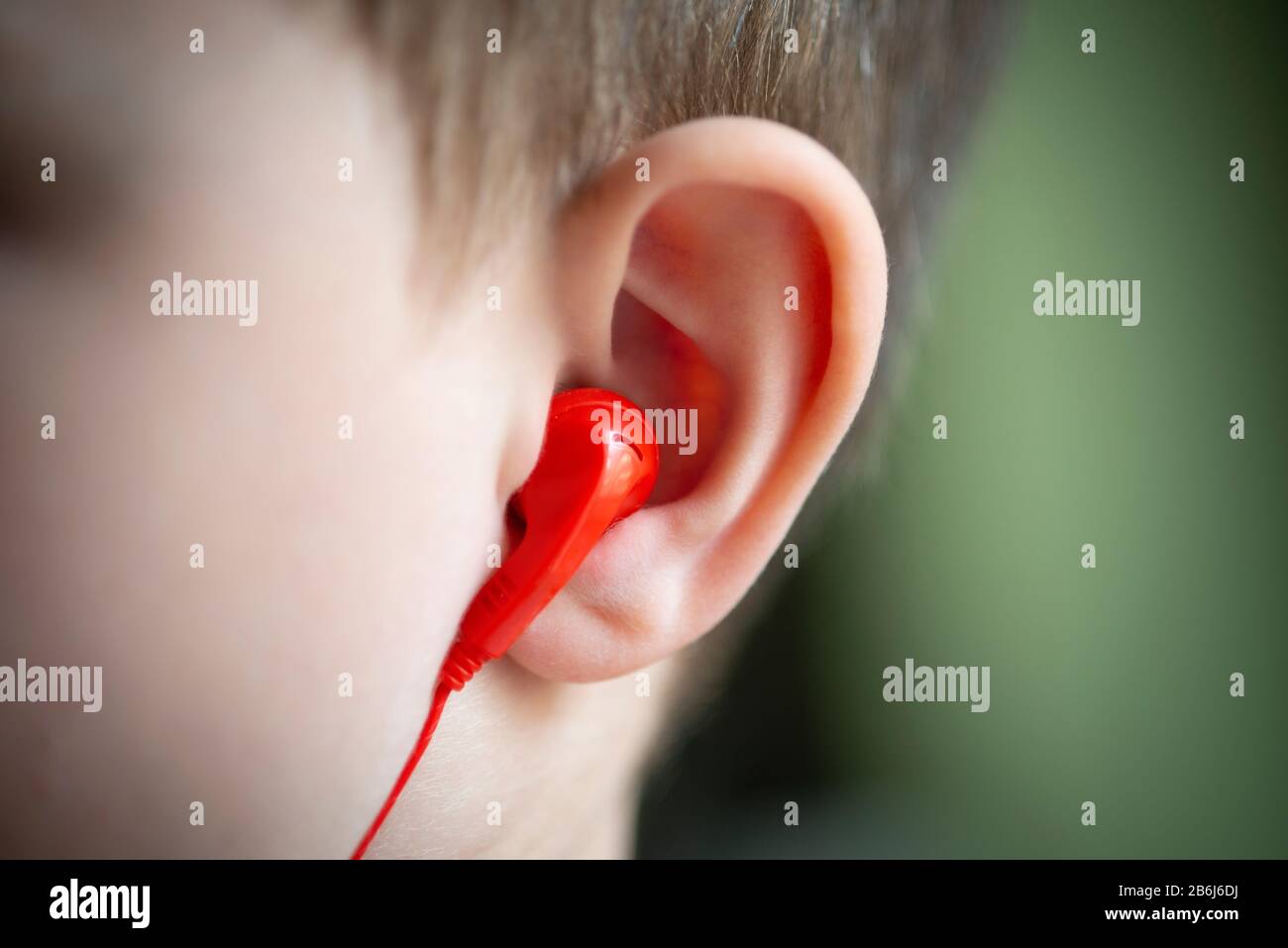 Little Boy and Ear Phones Stock Photo