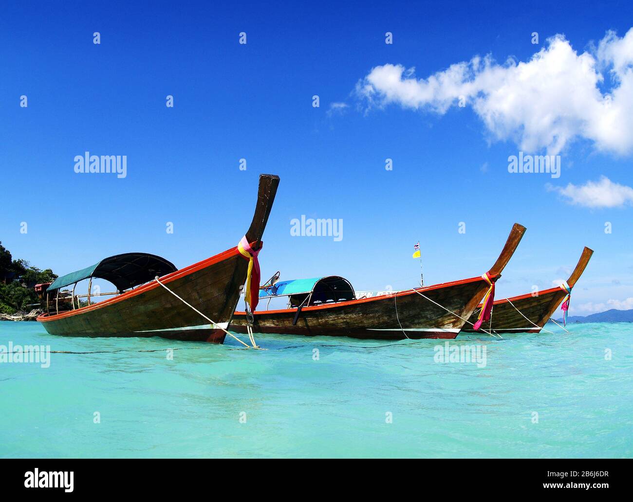 long tail boat, in white sand beach in andaman sea Stock Photo