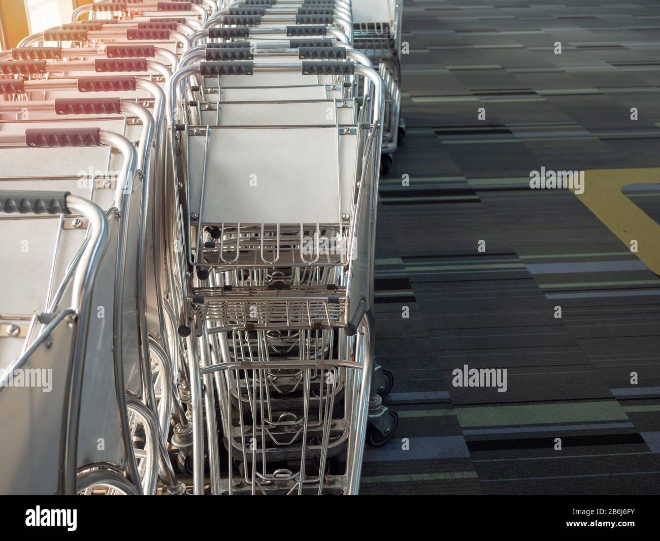 Airport luggage cart in airport near the glass window Stock Photo Alamy