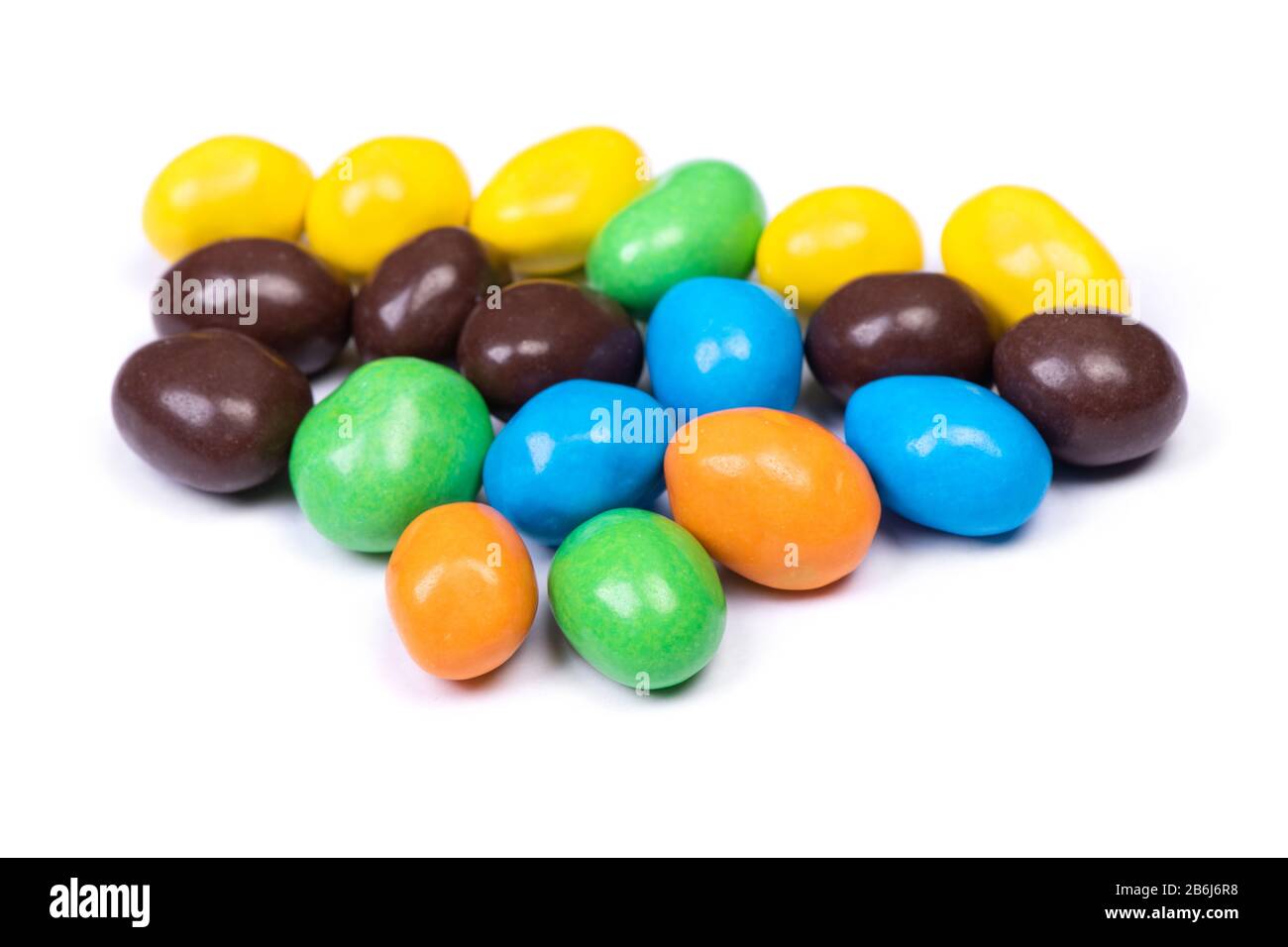 Pile of multi-colored glazed jelly beans isolated on white background Stock Photo