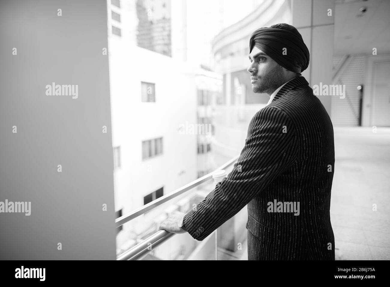 Indian businessman side view Black and White Stock Photos & Images - Alamy