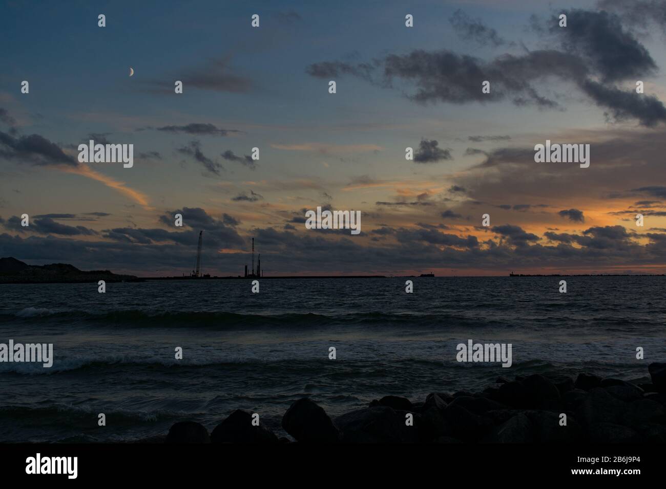 Beautiful orange sunset sky reflection on calm sea Stock Photo - Alamy