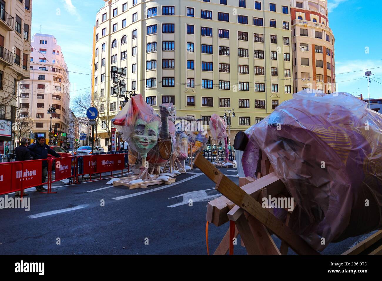 Unfinished wrapped Fallas figures in the streets of Valencia for the 2020 Fallas festival that has been canceled to prevent the spread of coronavirus. Stock Photo