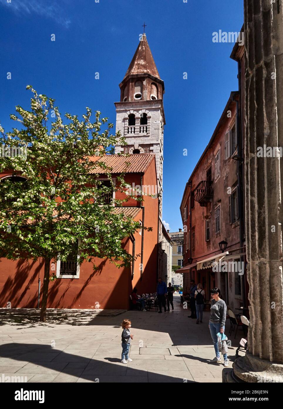 Zadar, Dalmatia province, Croatia, street scene in front of a traditional painted houses, square and Smijanica street paved with limestone and St Simeon's churchin the old tow, Zadar is an adorable fortified city, Stock Photo