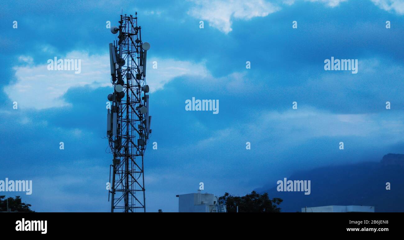 TELECOMMUNICATION TOWER IN CLOUDY CLIMATE Stock Photo
