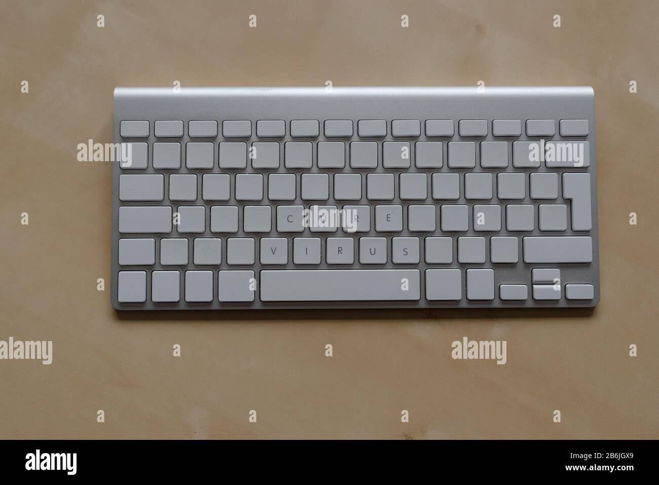keyboard with cure virus only written Stock Photo