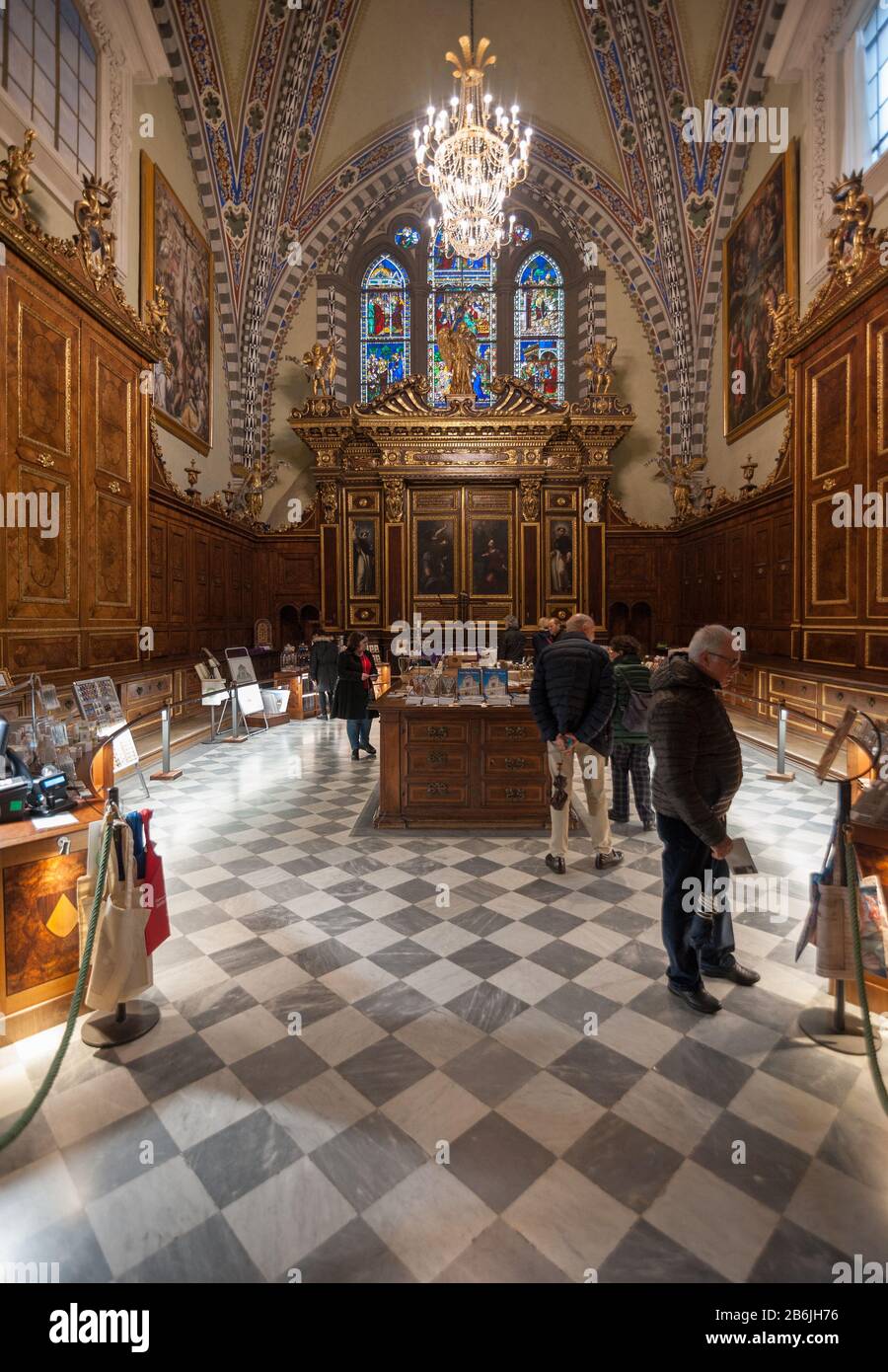 Florence, Italy - 2020, March 1: Visitors at the bookshop, housed in the Sagrestia of the Basilica Santa Maria Novella. Stock Photo