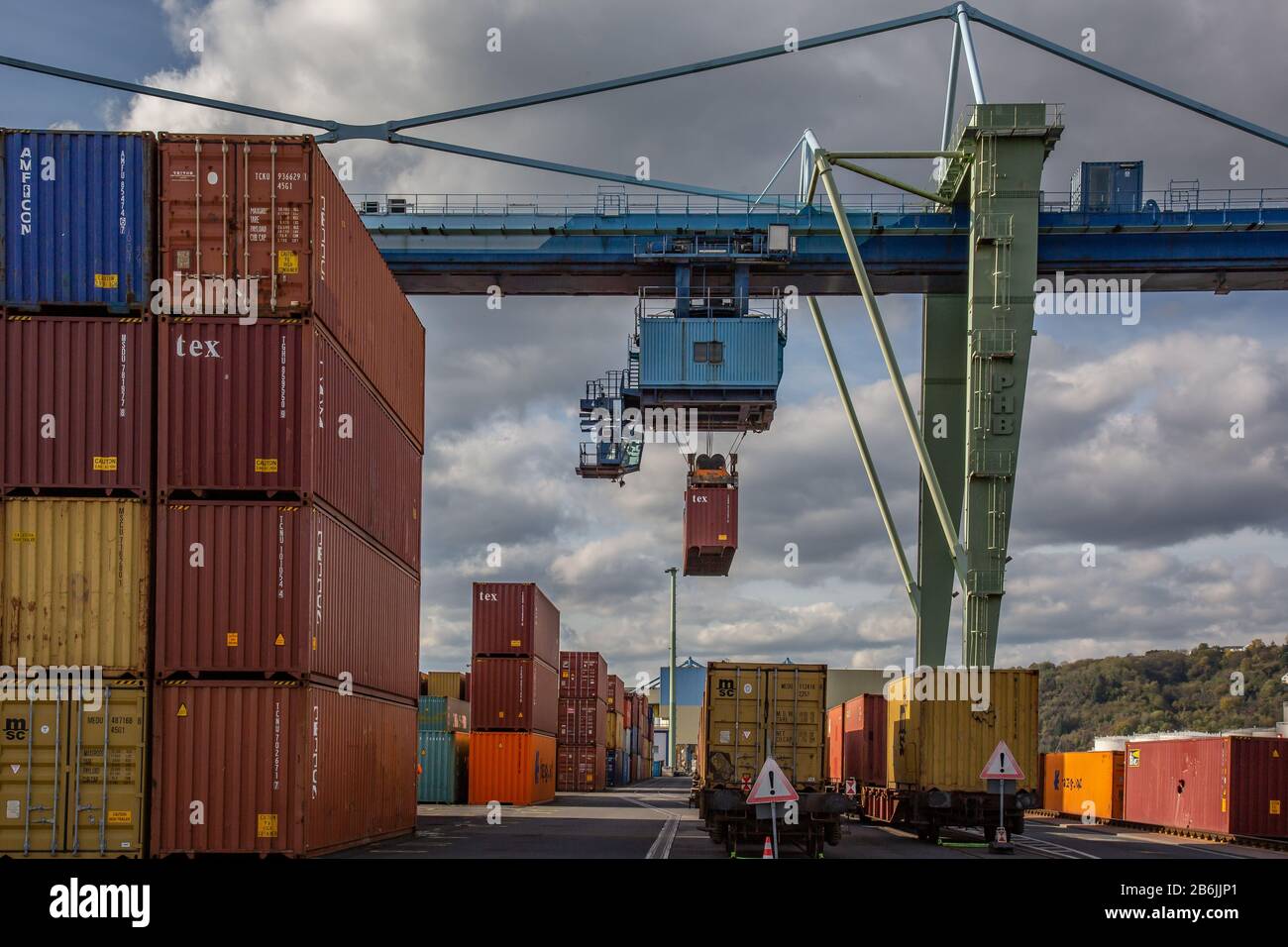 Andernach, Rhineland Palatinate, Germany - October 25, 2019: in a container terminal a container is lifted by a crane bridge Stock Photo