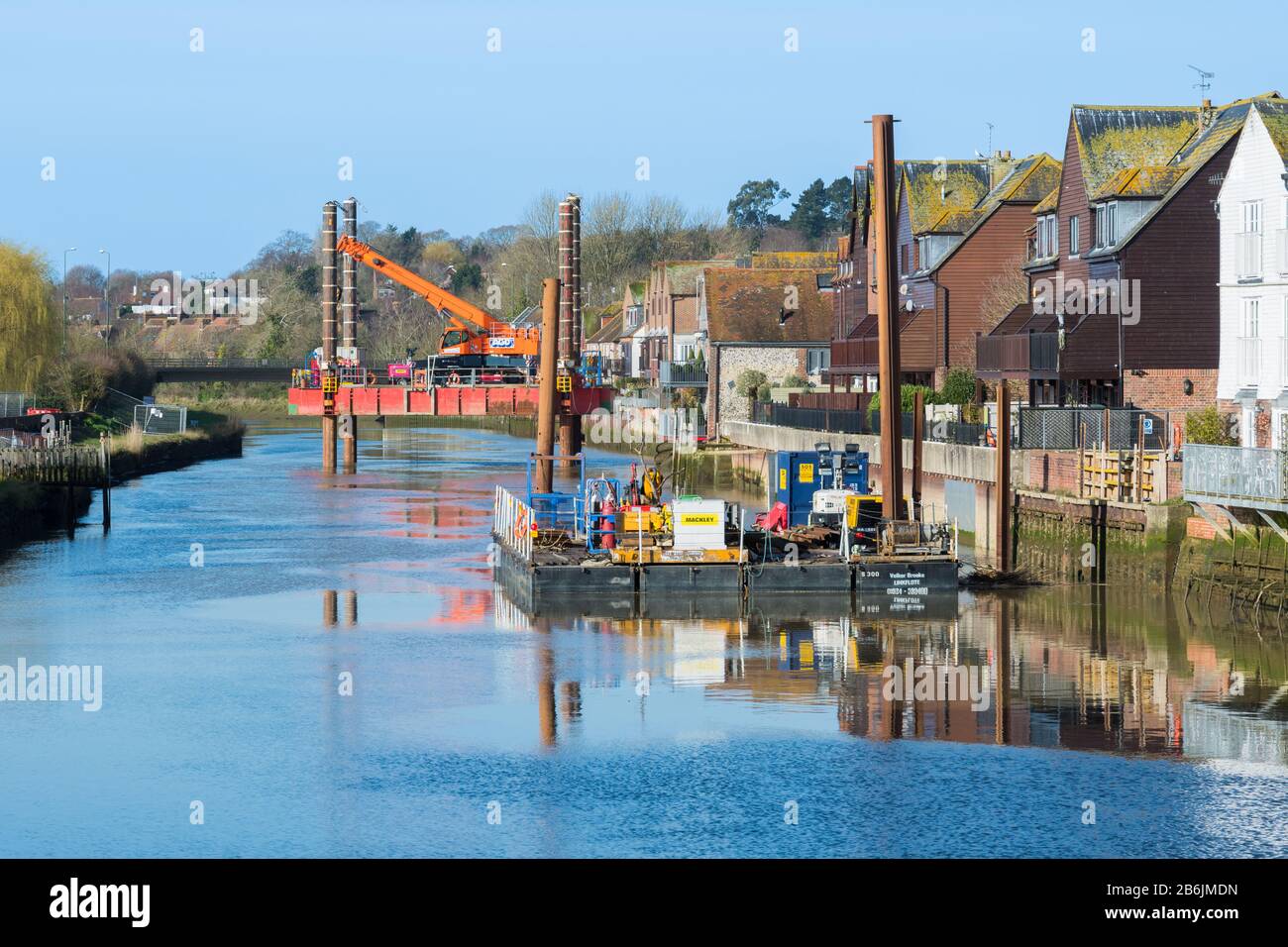 Arundel tidal defence scheme works using jack-up barge & industrial floating platforms on the River Arun in Arundel, West Sussex, England, UK. Stock Photo