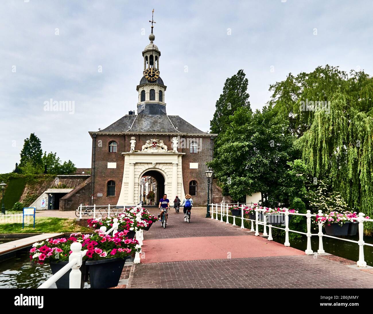 city of Leiden, provincof South Holland, Netherlands, Europe - Zijlpoort is a city gate in Leiden, The gate was built in 1667 in the classical style according to a design by the Leiden architect Willem van der Helm and with sculpture by Rombout Verhulst. Because the gates have to connect with the city wall as well as with a bridge, the building is in the forof a parallelogram. Together with the Morspoort, the Zijlpoort is the only onof the original eight gates that survive. Stock Photo