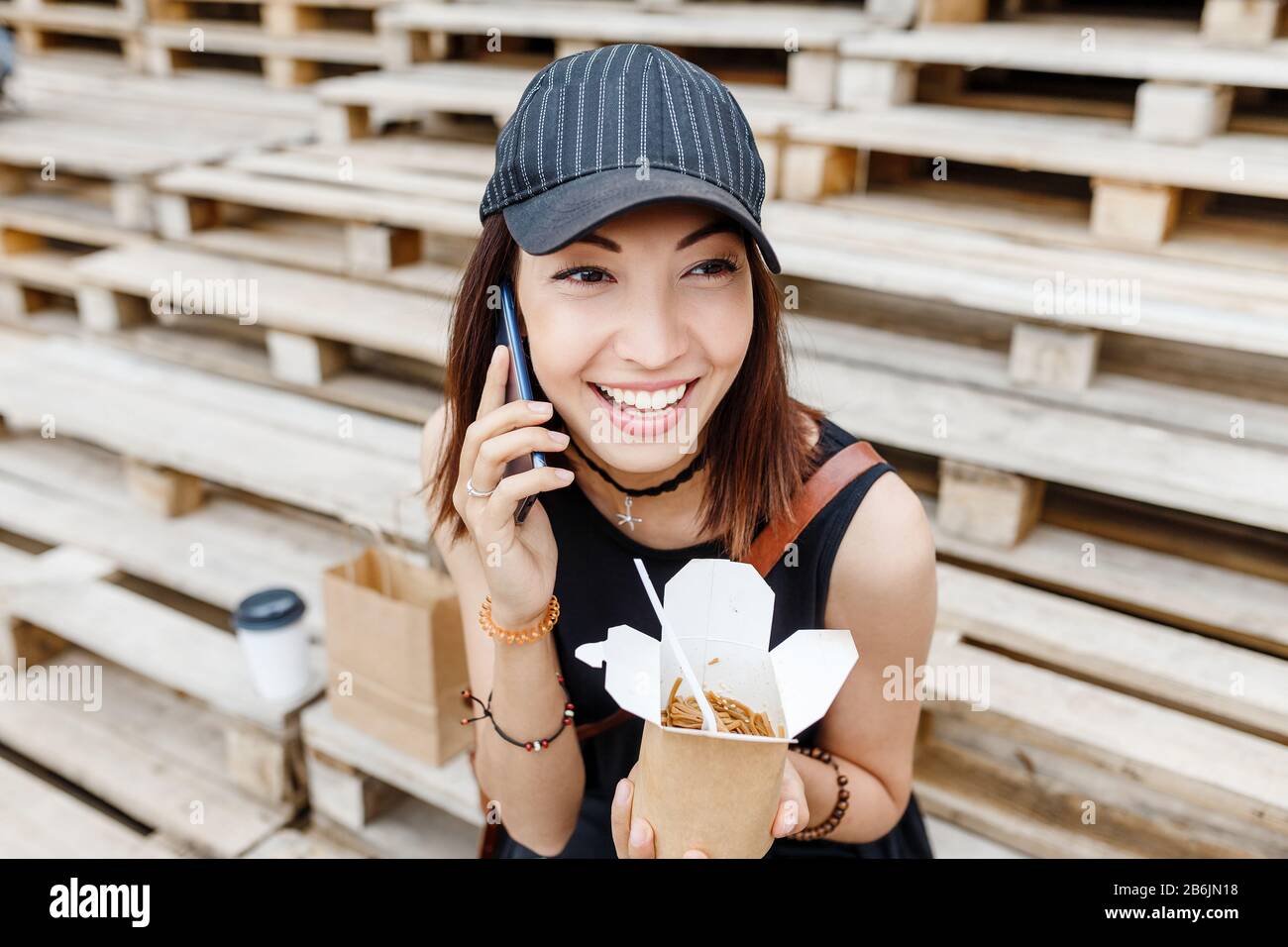 woman talking on the phone with the fast food delivery service Stock ...