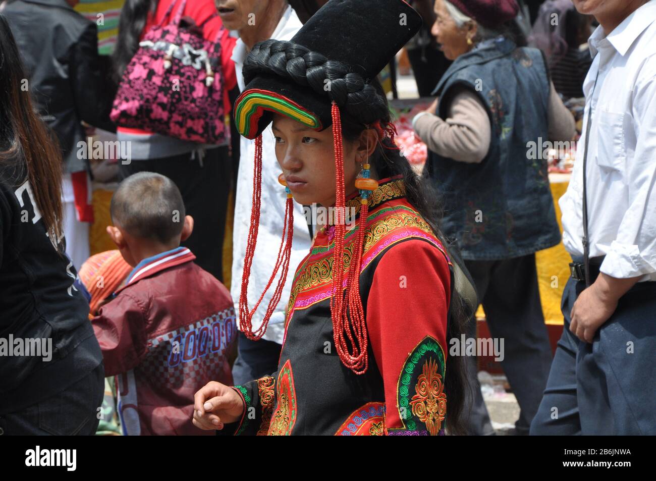 Yi woman in traditional costume - Shaxi singing festival - Shaxi Yunnan China Stock Photo