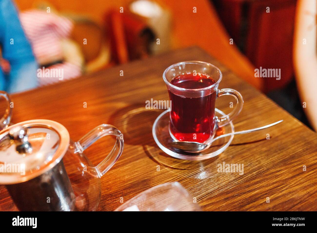 Turkish tea in traditional glass on table in cafe Stock Photo