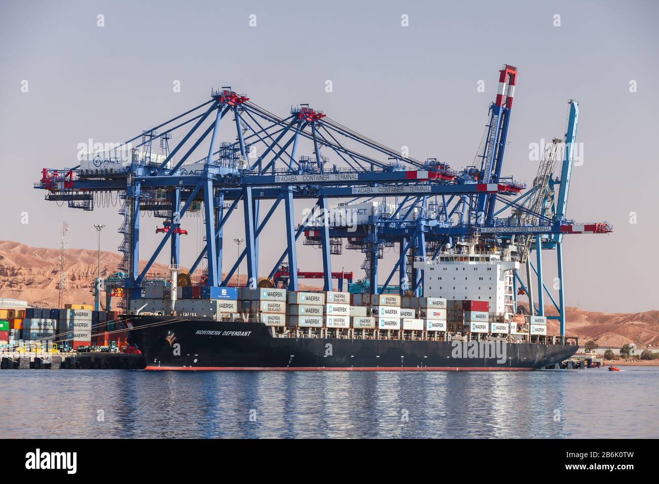 Aqaba, Jordan - May 18, 2017: Gantry cranes unload container ship Northern  Dependant. Aqaba container terminal at sunny summer day Stock Photo - Alamy