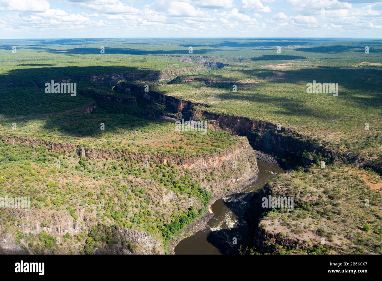 Aerial view of Zambezi River in the border of Zimbabwe and Zambia. River between canyons. Zigzag gorges of Victoria Falls. Stock Photo