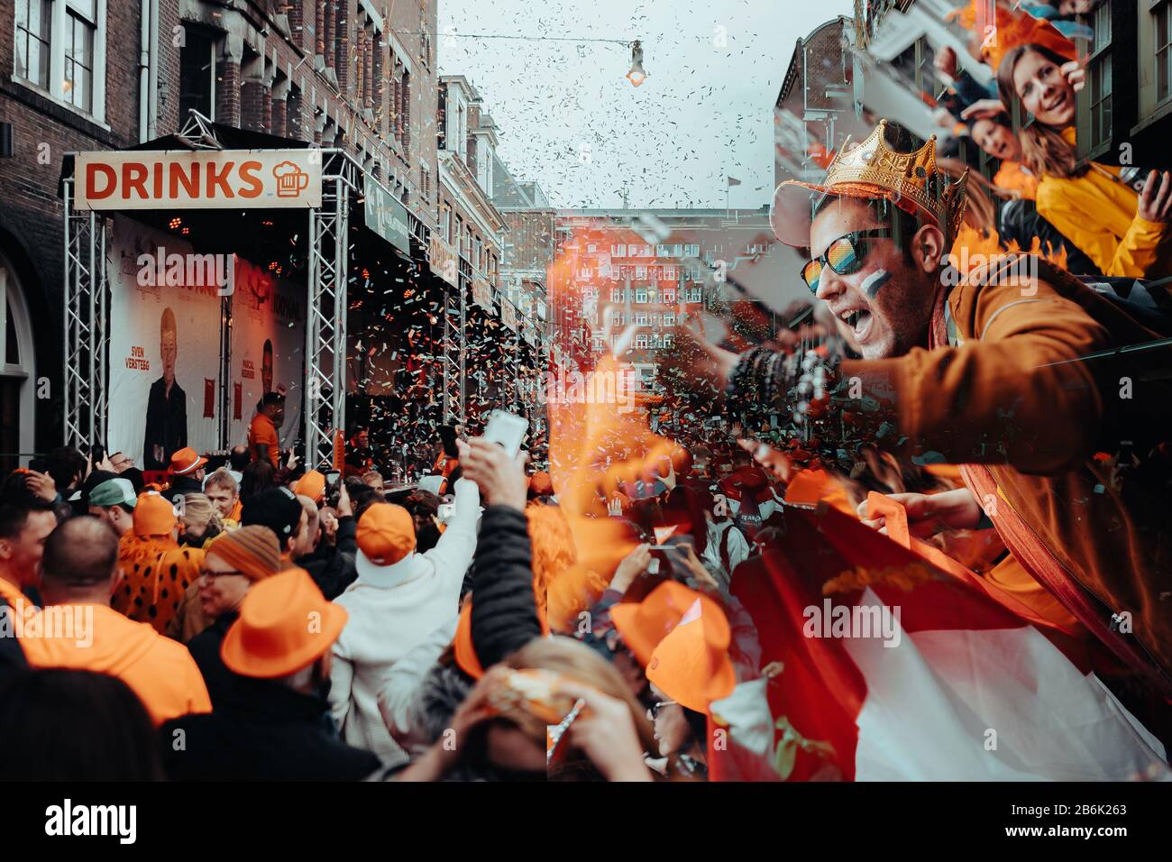 Orange party-goers take over the streets of Amsterdam to celebrate the King's Birthday on Koningsdag. Stock Photo