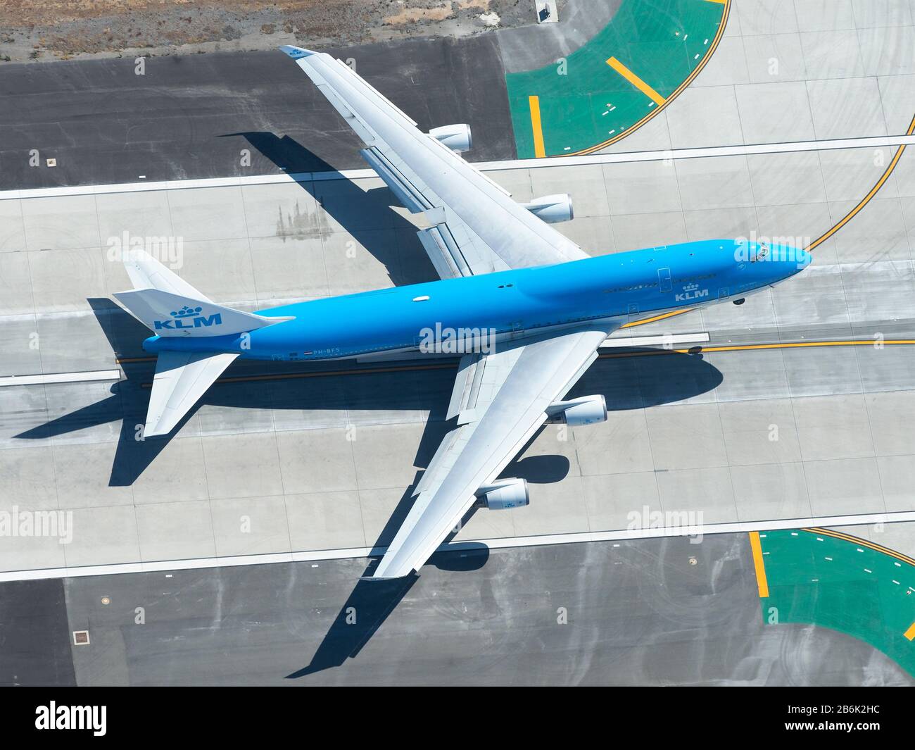 Aerial view of Royal Dutch Airlines Boeing 747 departure from LAX airport. KLM B747 aircraft taking off. Jumbo airplane model being retired by KLM. Stock Photo