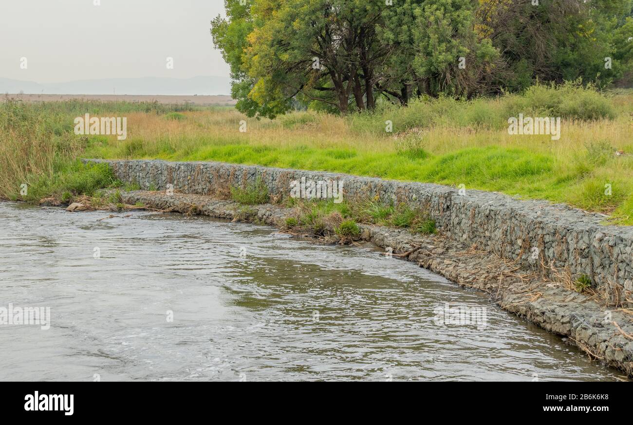 Gabion retaining walls to control erosion and flooding on the banks of
