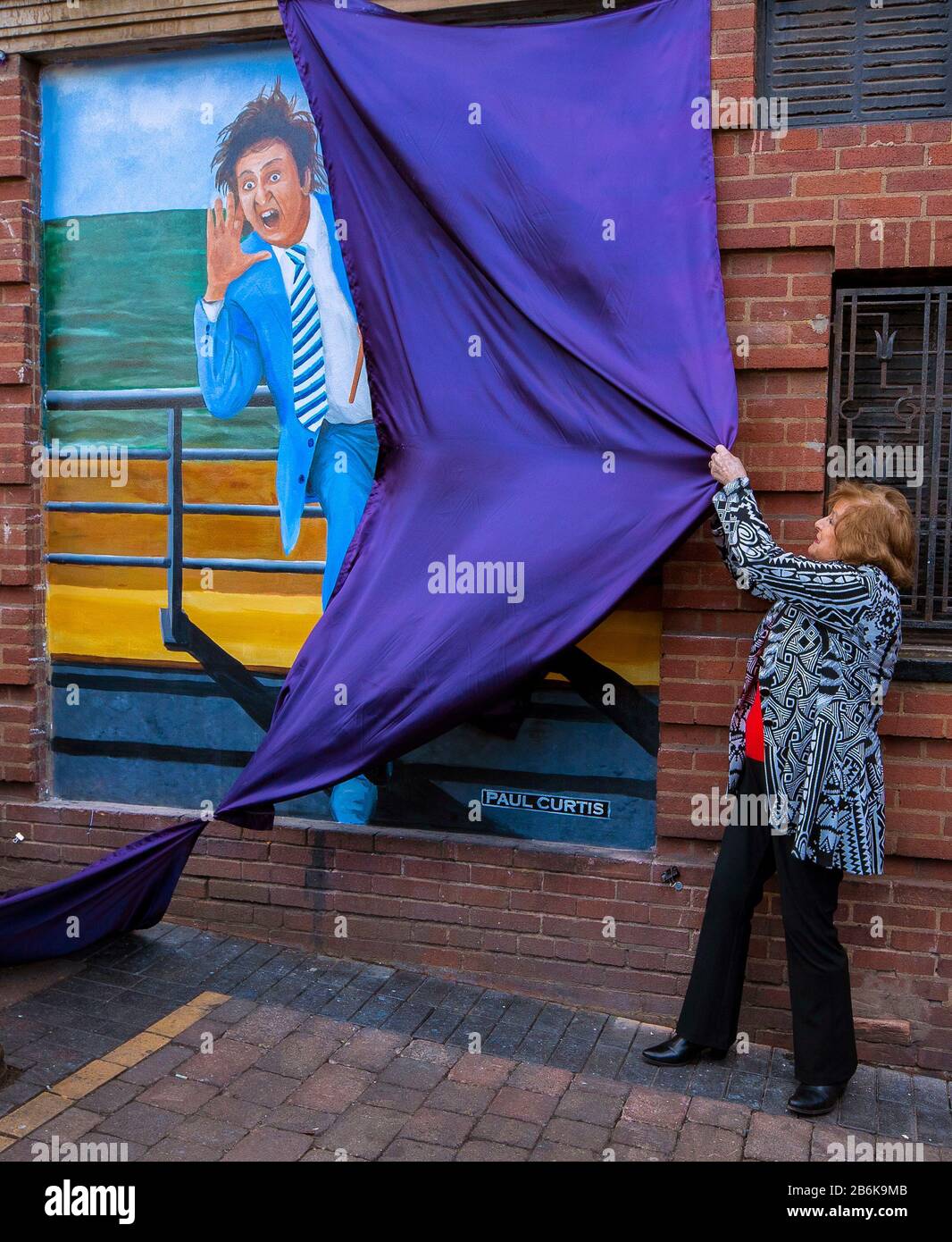 Lady Anne Dodd unveils the mural of Ken Dodd at the Liverpool Royal Court Theatre, Liverpool. PA Photo. Picture date: Wednesday March 11, 2020. The mural was commissioned by The Comedy Trust and was created by the artist Paul Curtis. Photo credit should read: Peter Byrne/PA Wire Stock Photo