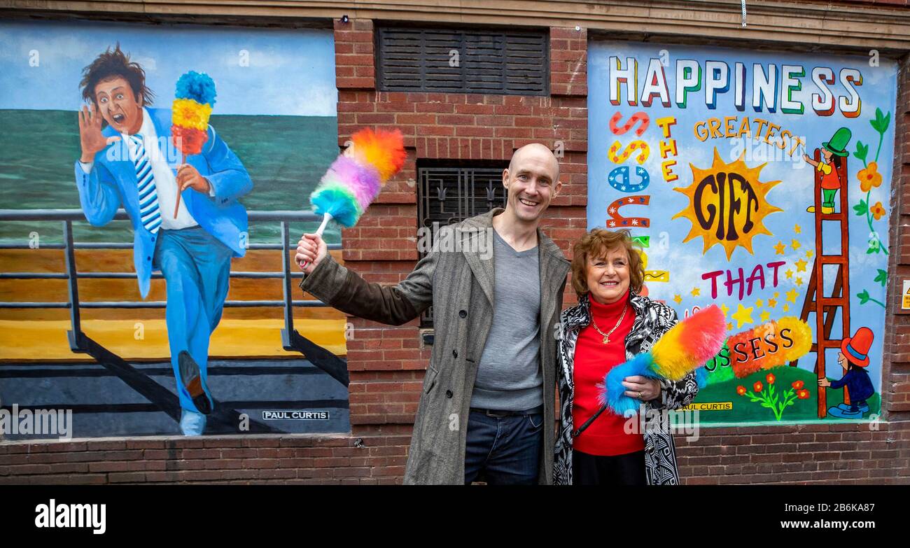 Lady Anne Dodd and Paul Curtis unveil the mural of Ken Dodd at the Liverpool Royal Court Theatre, Liverpool. PA Photo. Picture date: Wednesday March 11, 2020. The mural was commissioned by The Comedy Trust and was created by the artist Paul Curtis. Photo credit should read: Peter Byrne/PA Wire Stock Photo