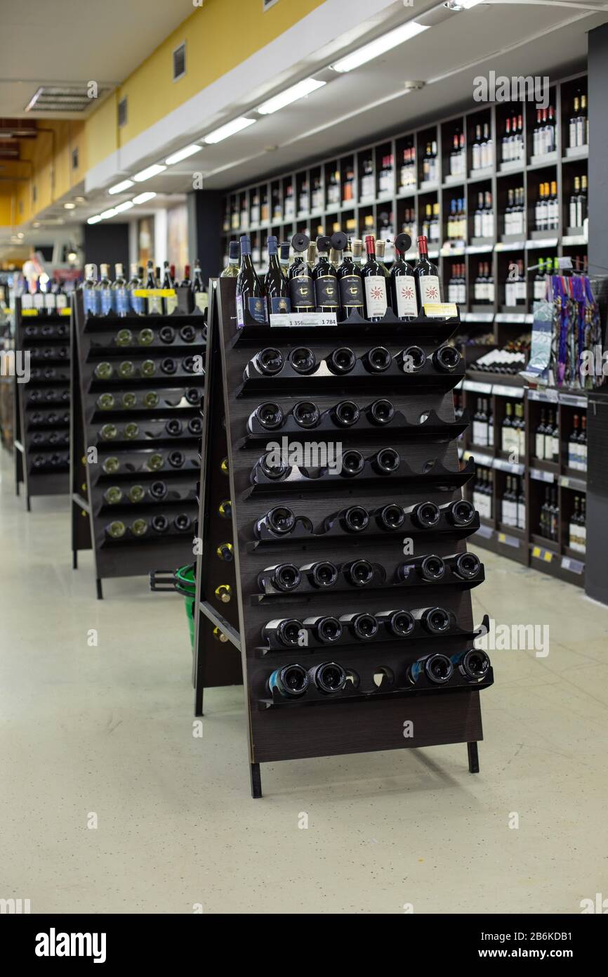Moscow, Russia - January 6, 2020: Department of alcoholic beverages in the supermarket, rack for bottles of grape wine from Italy, France and Spain. I Stock Photo
