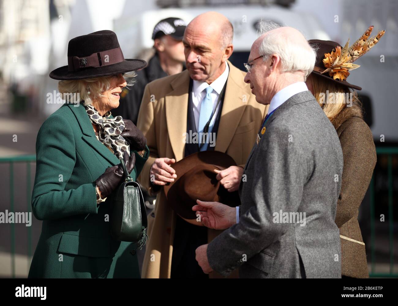 The Duchess of Cornwall speaks with Ian Renton (Regional Director Cheltenham and the South West - The Jockey Club) during day two of the Cheltenham Festival at Cheltenham Racecourse. Stock Photo