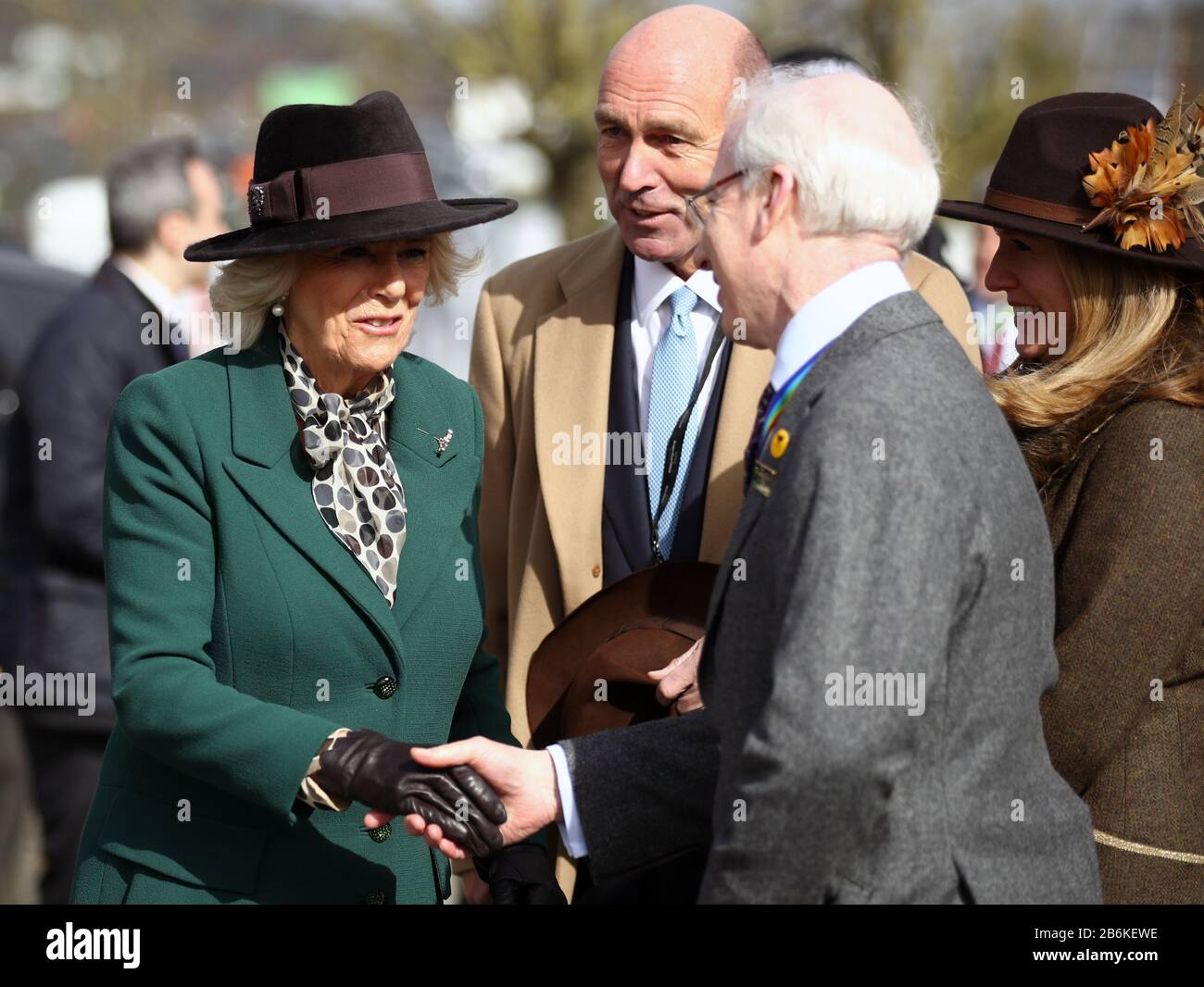 The Duchess of Cornwall speaks with Ian Renton (Regional Director Cheltenham and the South West - The Jockey Club) during day two of the Cheltenham Festival at Cheltenham Racecourse. Stock Photo