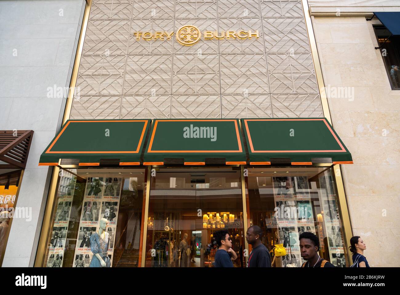 Pedestrians walk past an american fashion brand Tory Burch store Stock  Photo - Alamy