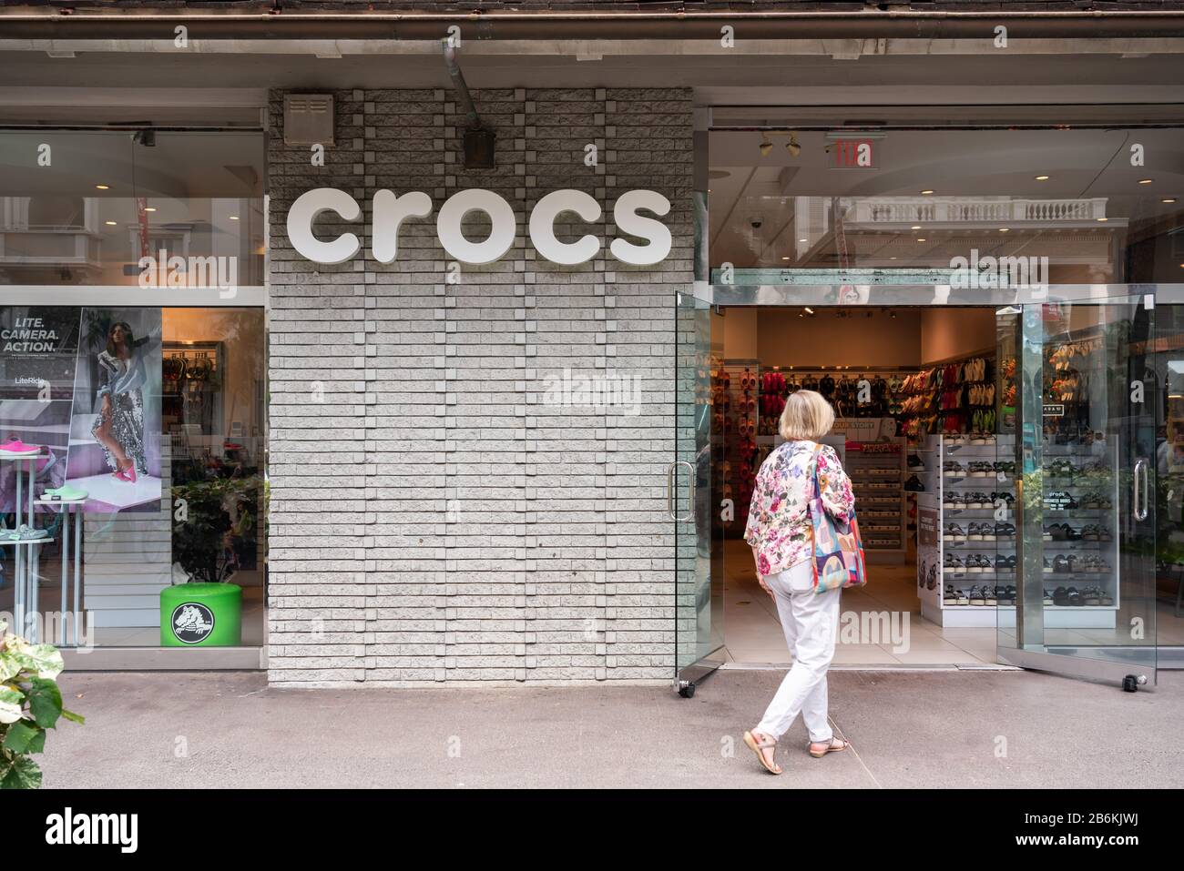 A customer walks into an american foam clog shoes company Crocs store Stock  Photo - Alamy