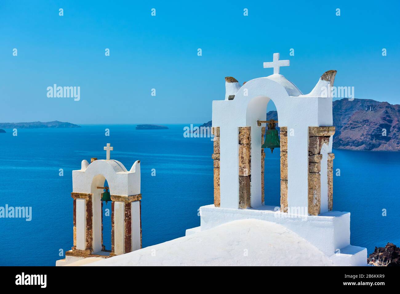 Bell towers of greek orthodox church above the sea in Santorini island, Greece Stock Photo