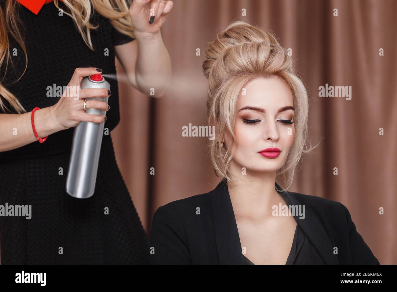 Professional Hairdresser Using Hair Spray On Client Business Woman Hair At Beauty Salon Stock Photo Alamy