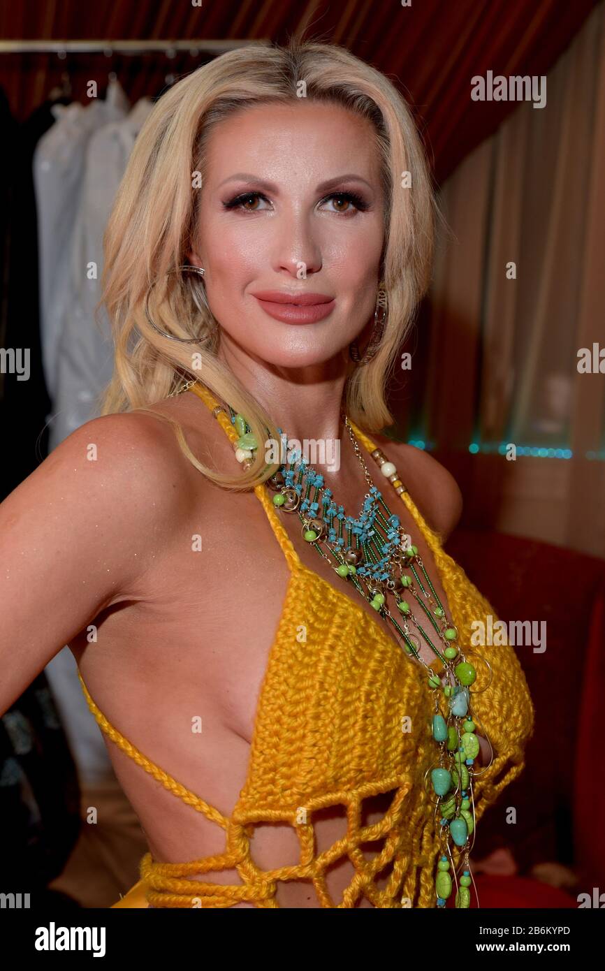 mMODEL WEARING SOLID PURPLE DRESS Stock Photo