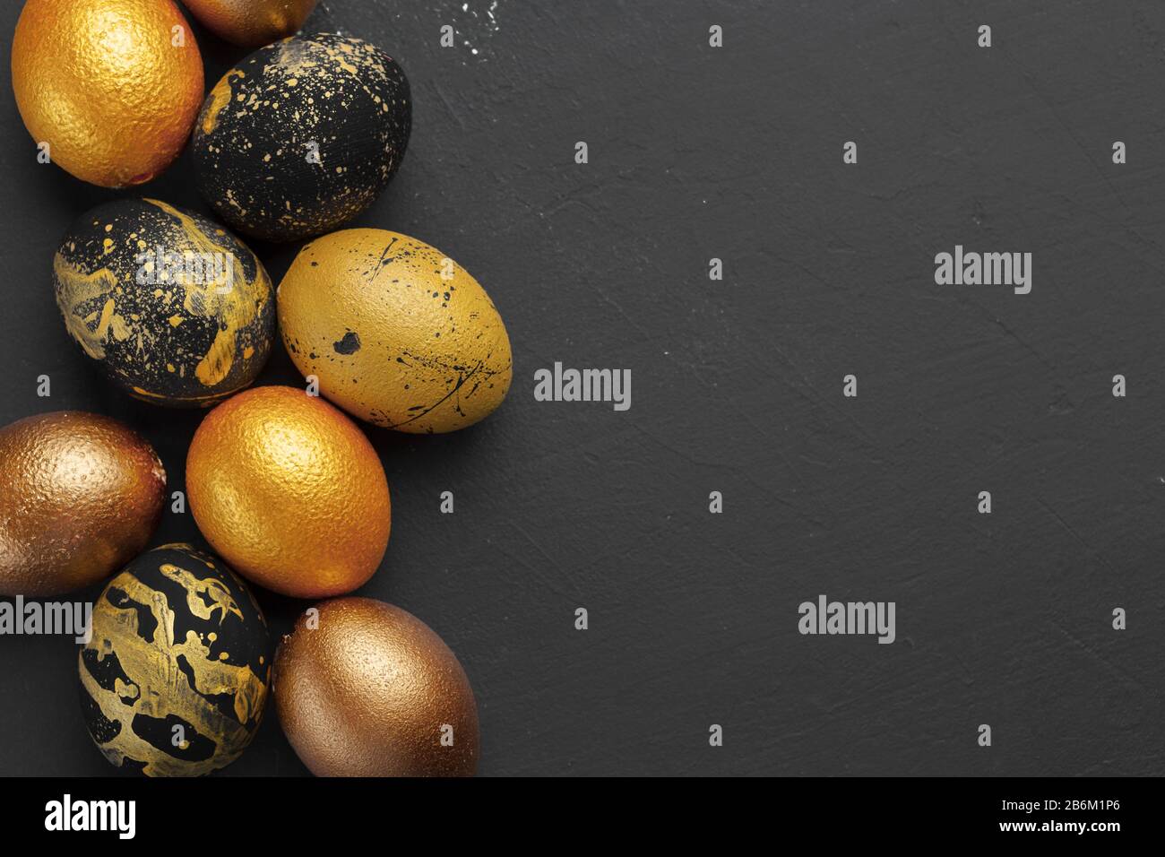 Background with golden decorated easter eggs Stock Photo