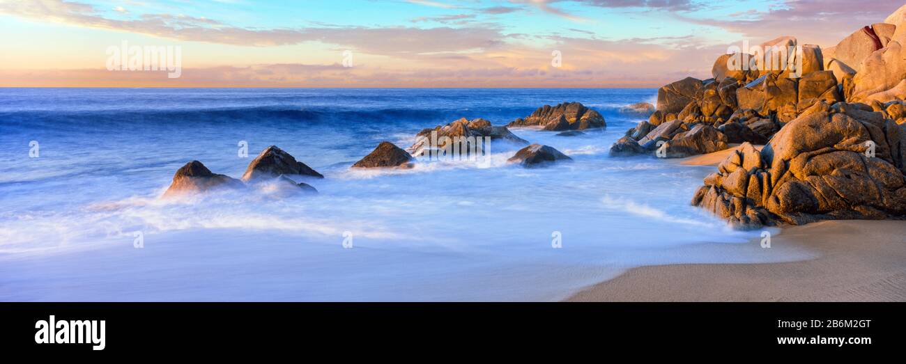 Rock formations on the beach at sunrise, Lands End, Cabo San Lucas, Baja California Sur, Mexico Stock Photo