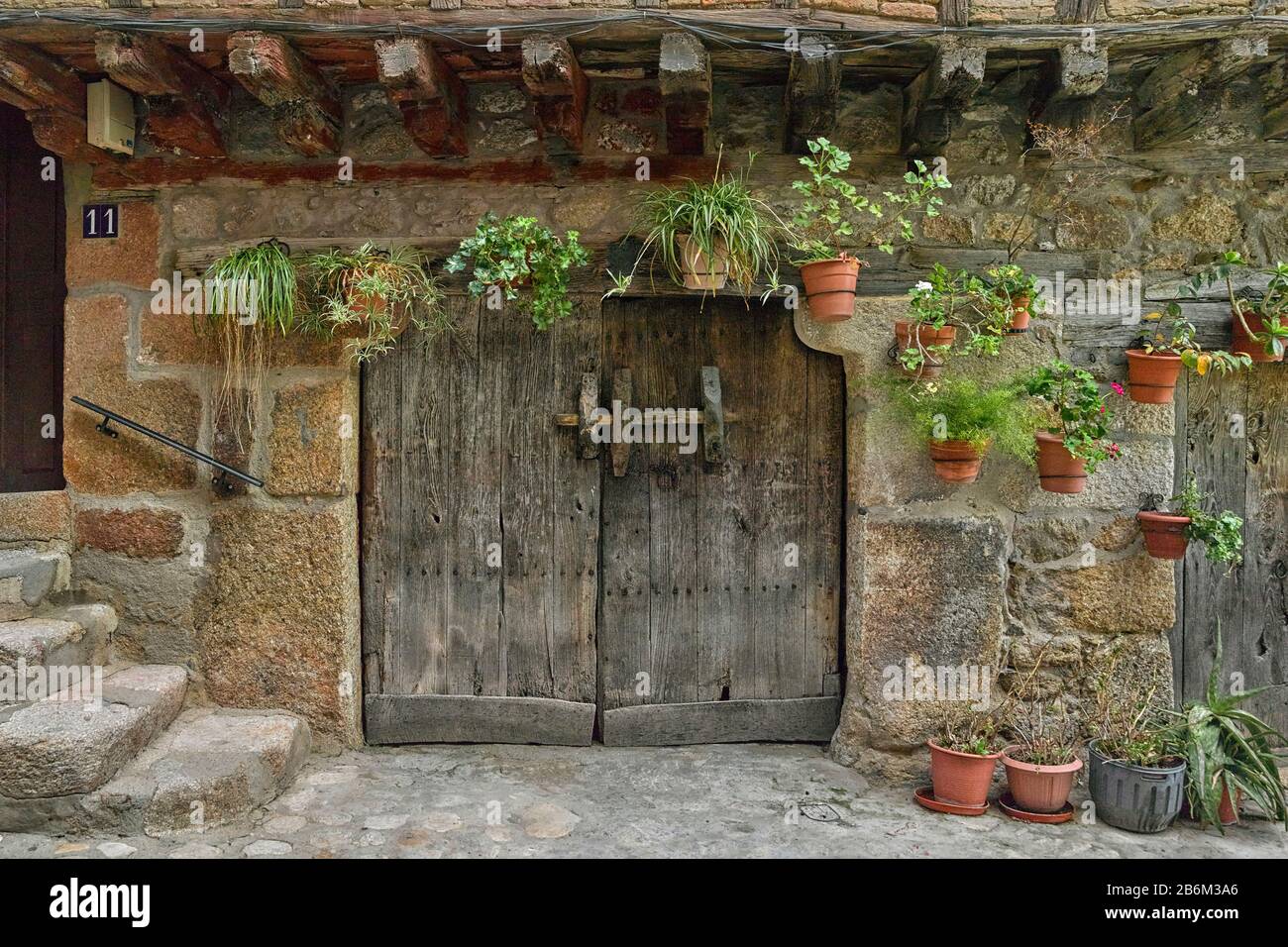 Typical traditional wooden front door, San Martin de Trevejo, Caceres, Caceres Province, Spain Stock Photo