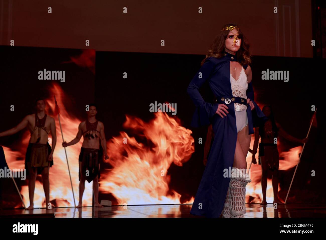 mMODEL WEARING SOLID PURPLE DRESS Stock Photo