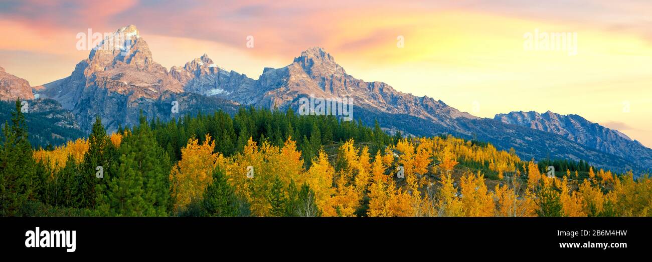 Sunrise over mountain range, Teton Range, Taggart Lake Trail, Grand Teton National Park, Wyoming, USA Stock Photo