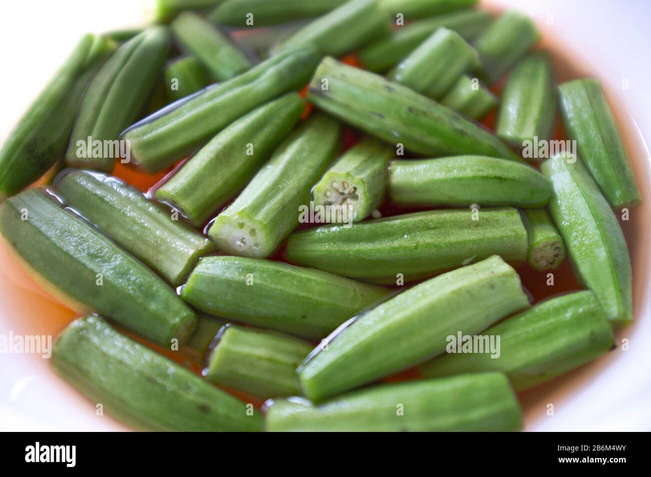 Fresh raw okra in water Stock Photo Alamy