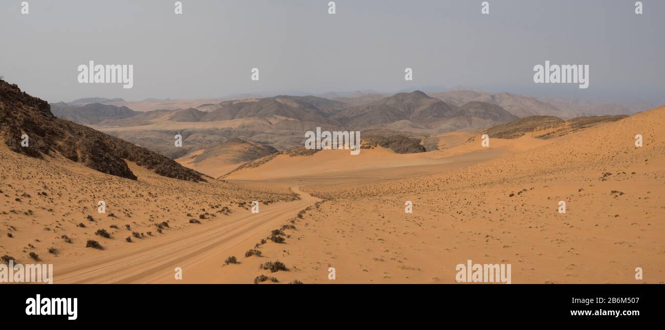 Tire track through desert, Hartmann Valley, Kunene, Namibia Stock Photo