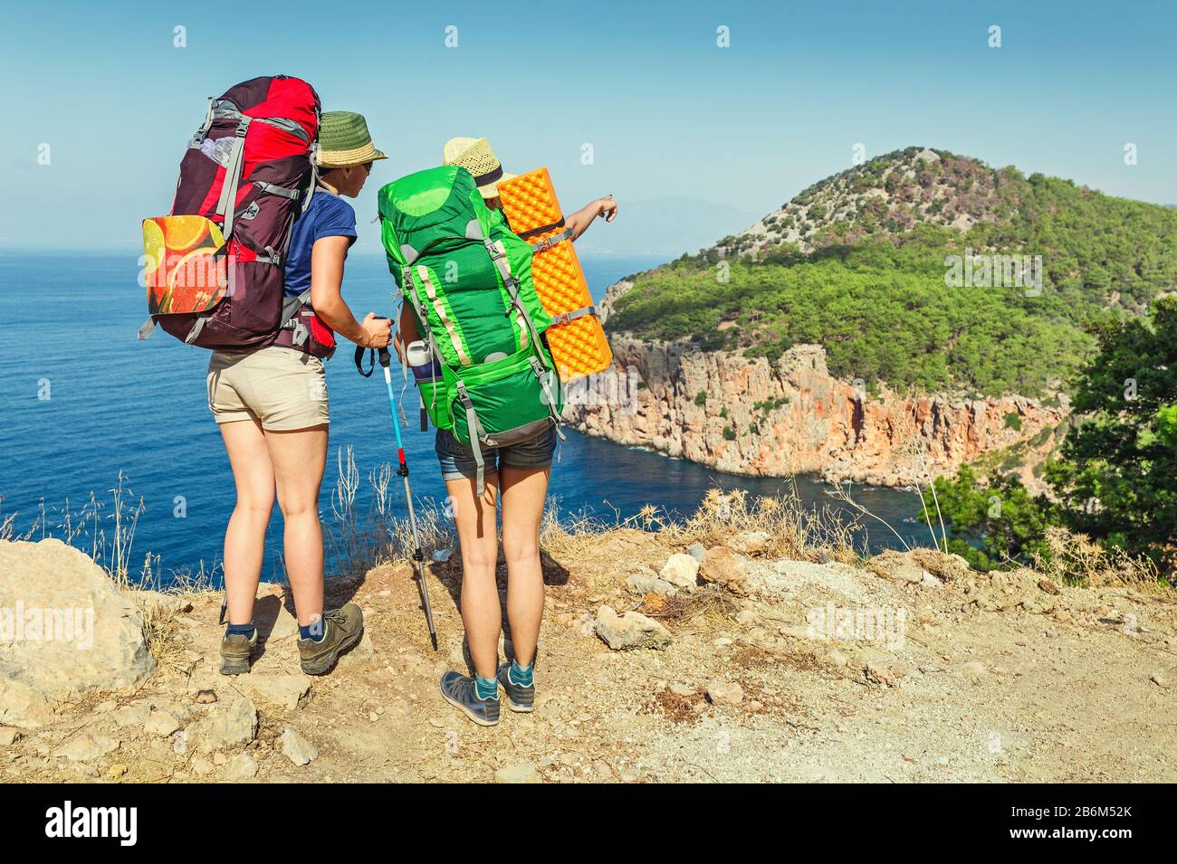 Two hikers climbing mountain hi-res stock photography and images - Alamy