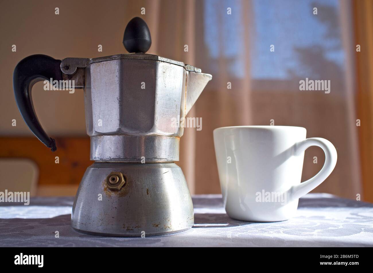 Cup and Coffee Pot with Coffee on White Table Stock Image - Image