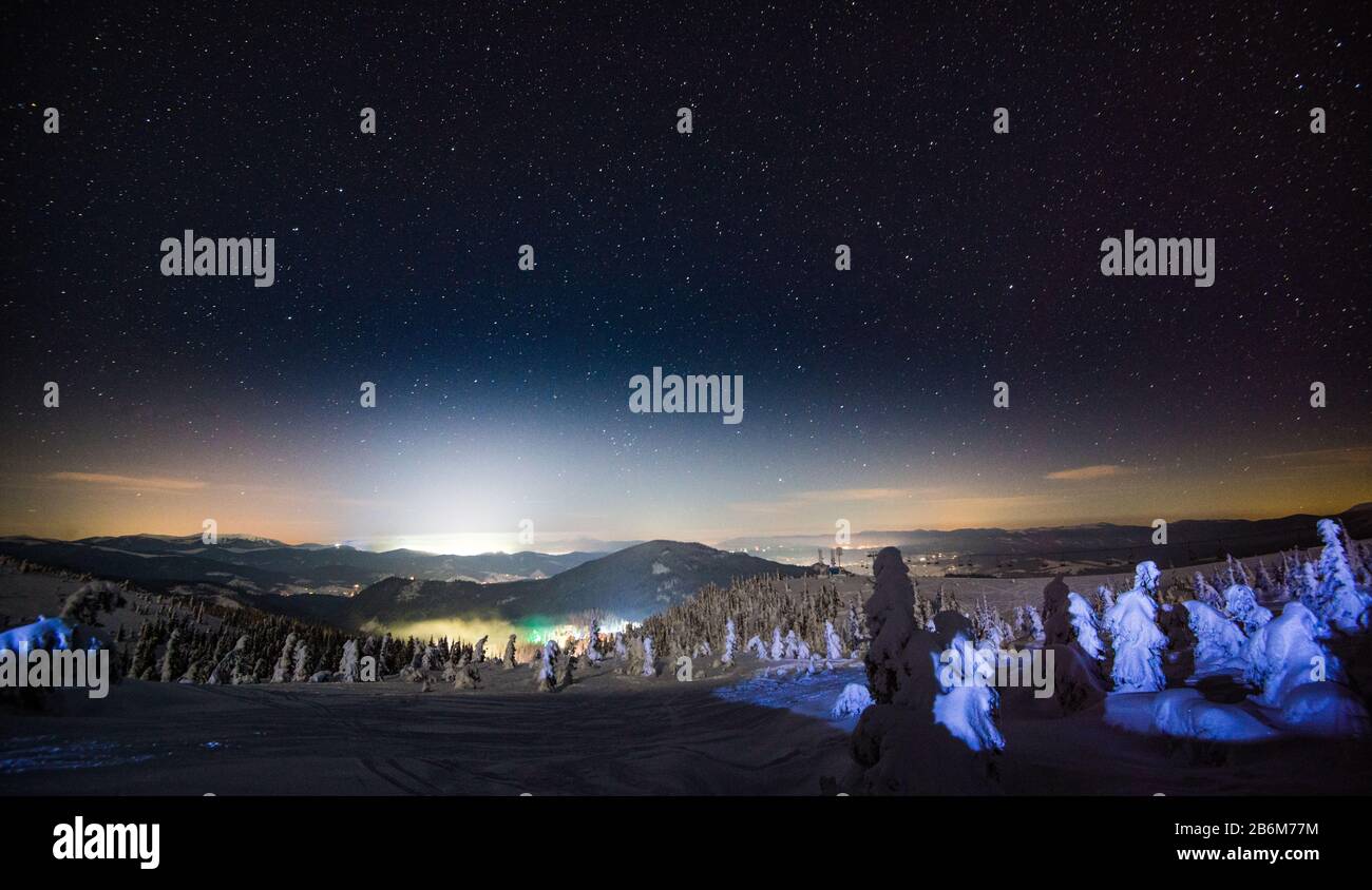 Amazing view of the beautiful ski slopes on a late starry night ...
