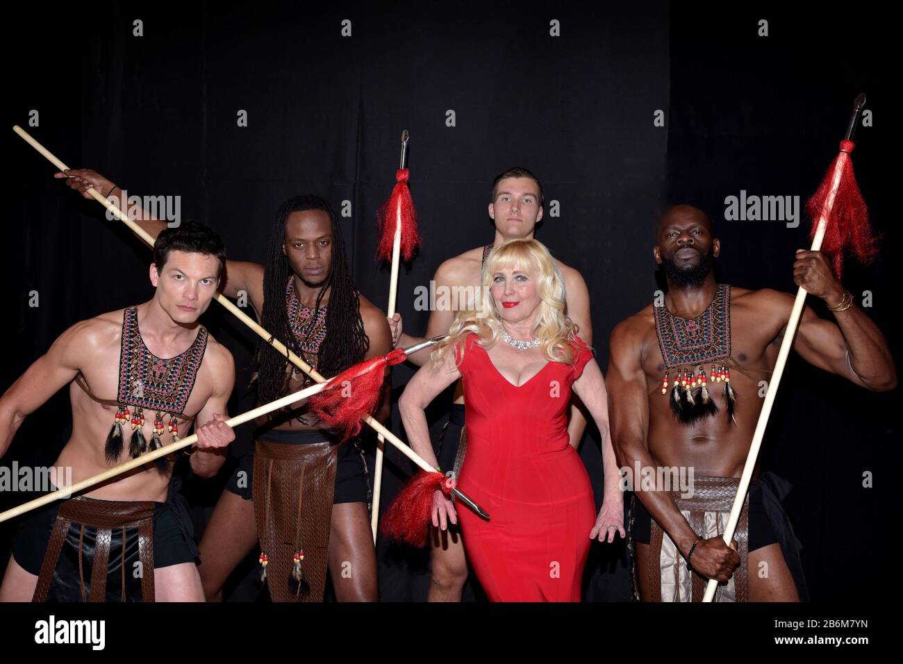 mMODEL WEARING SOLID PURPLE DRESS Stock Photo