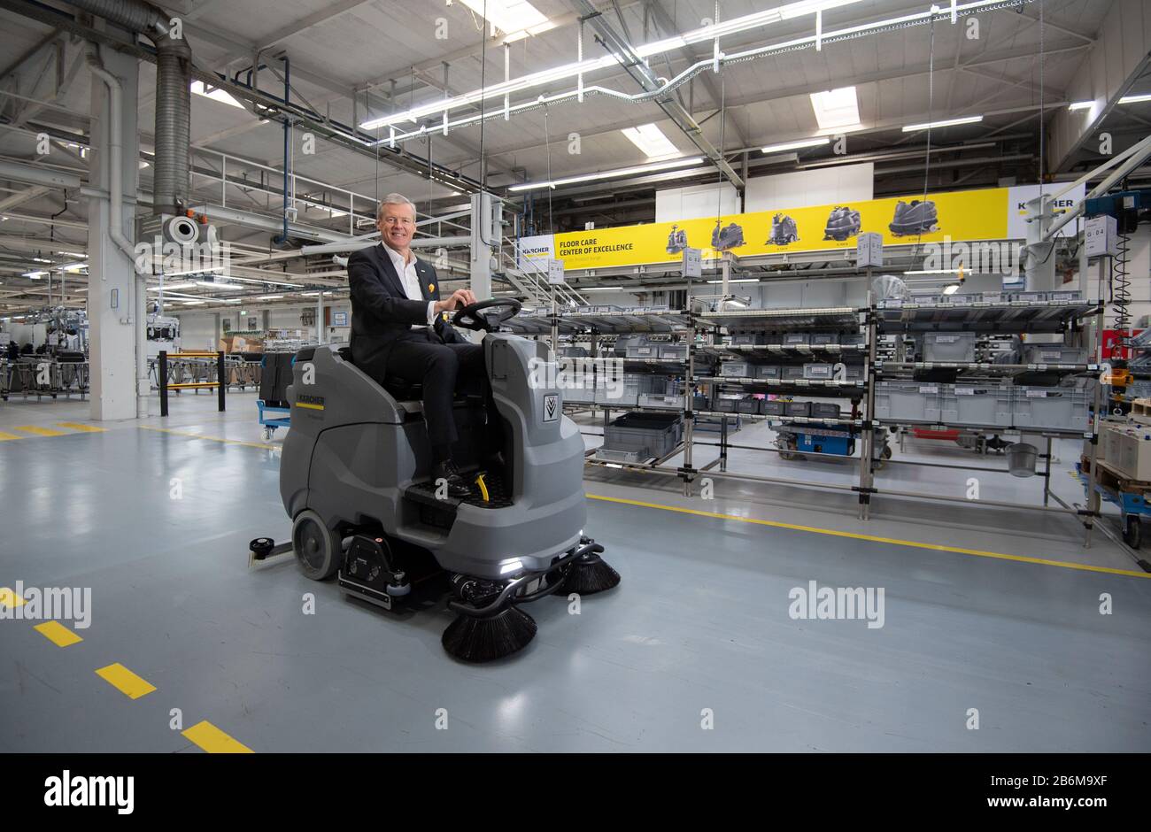 Winnenden, Germany. 09th Mar, 2020. Hartmut Jenner, Chairman of the  Management Board of Alfred Kärcher SE & Co. KG, drives on a scrubbing  machine in a factory building. (to dpa "Kärcher CEO