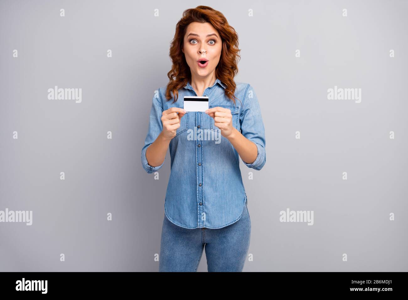 Portrait of astonished woman hold credit card impressed by banking online  easy payment system scream wow omg wear good look style clothes isolated  Stock Photo - Alamy
