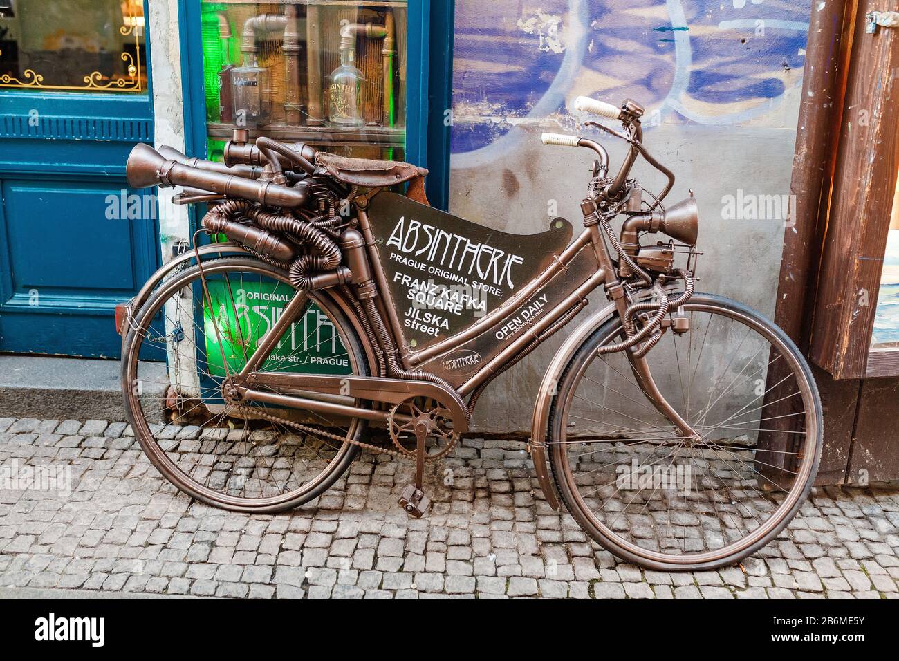 07 DECEMBER 2017, PRAGUE, CZECH REPUBLIC: bicycle in a steampunk style near absinthe shop Stock Photo
