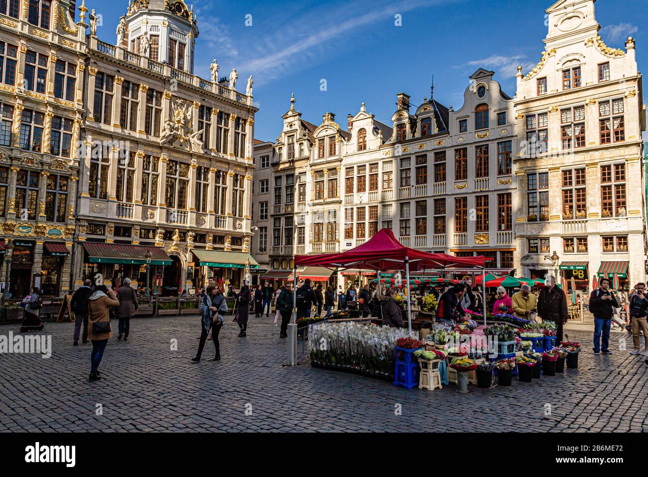 A stall selling flowers on Grand Place, the main pedestrianised square in the city centre of Brussels, capital city of Belgium. March 2019. Stock Photo